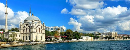 An image of the Bosphorus Cruise Tour on a Tailor-Made Tours in Istanbul, Turkey, with a view of the Dolmabahçe Mosque and Palace.